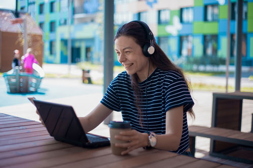 Girl with Headphones on Virtual Meeting